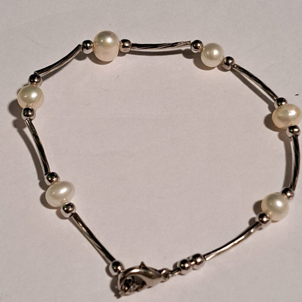 silver color and pearl like beaded bracelet